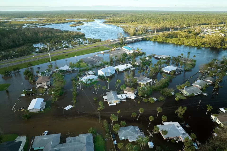 Aerial view of flooded small homes in Florida after hurricane.
